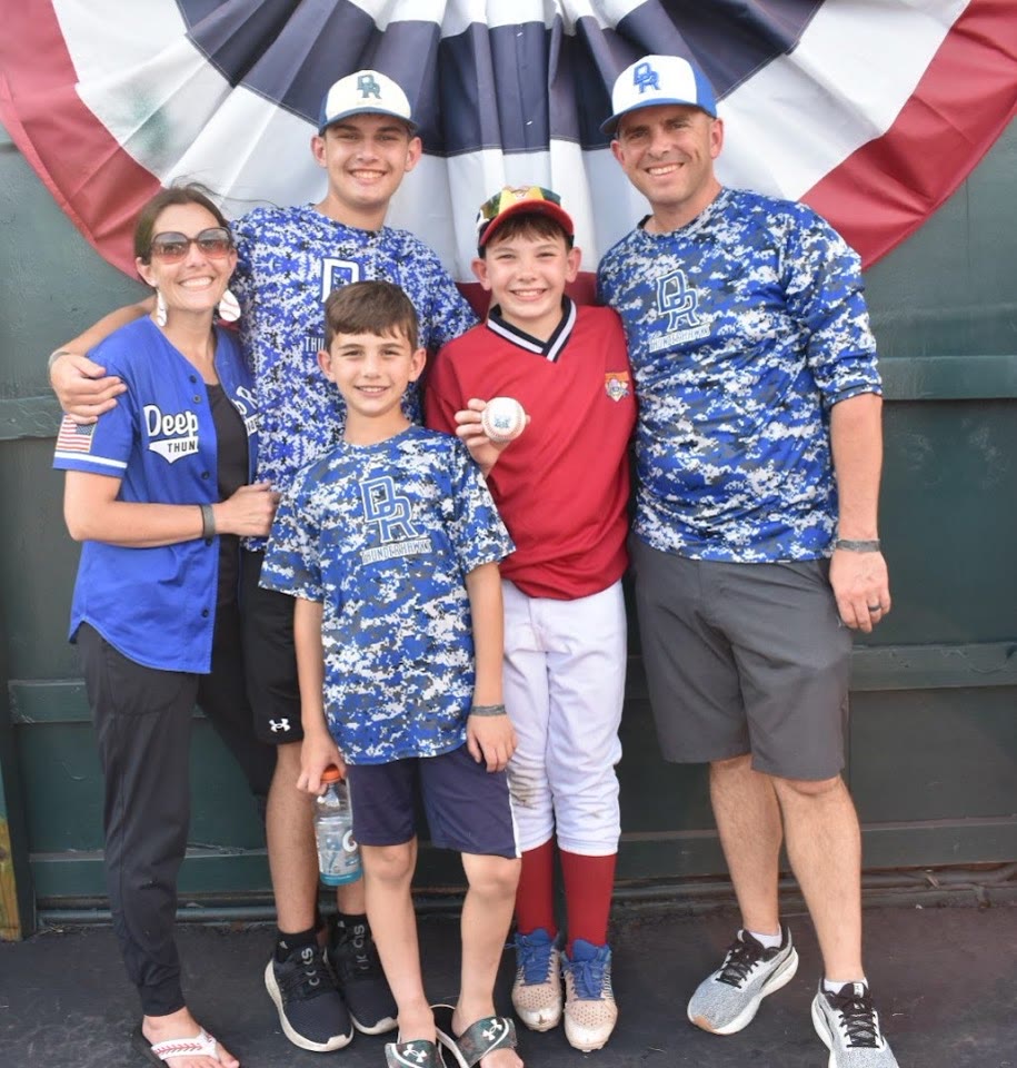Evan Lowery with his family in Deep Run Thunderhawks baseball gear