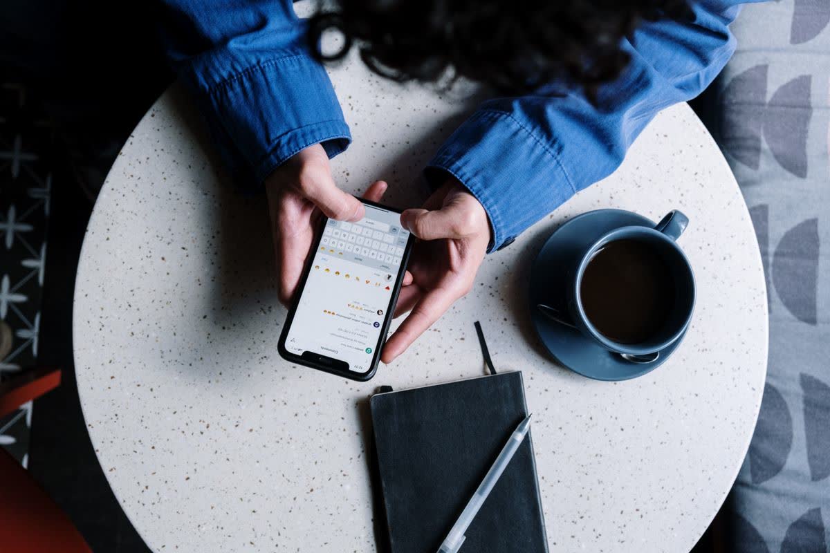 Business owner checking messages on a phone